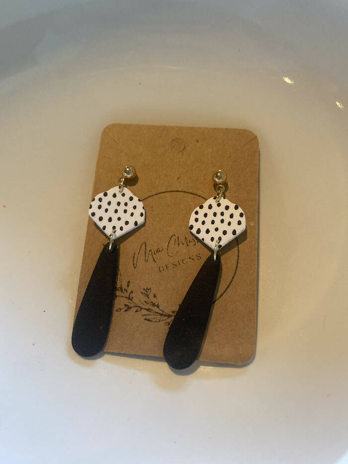 Black bar with white and black dot dangle