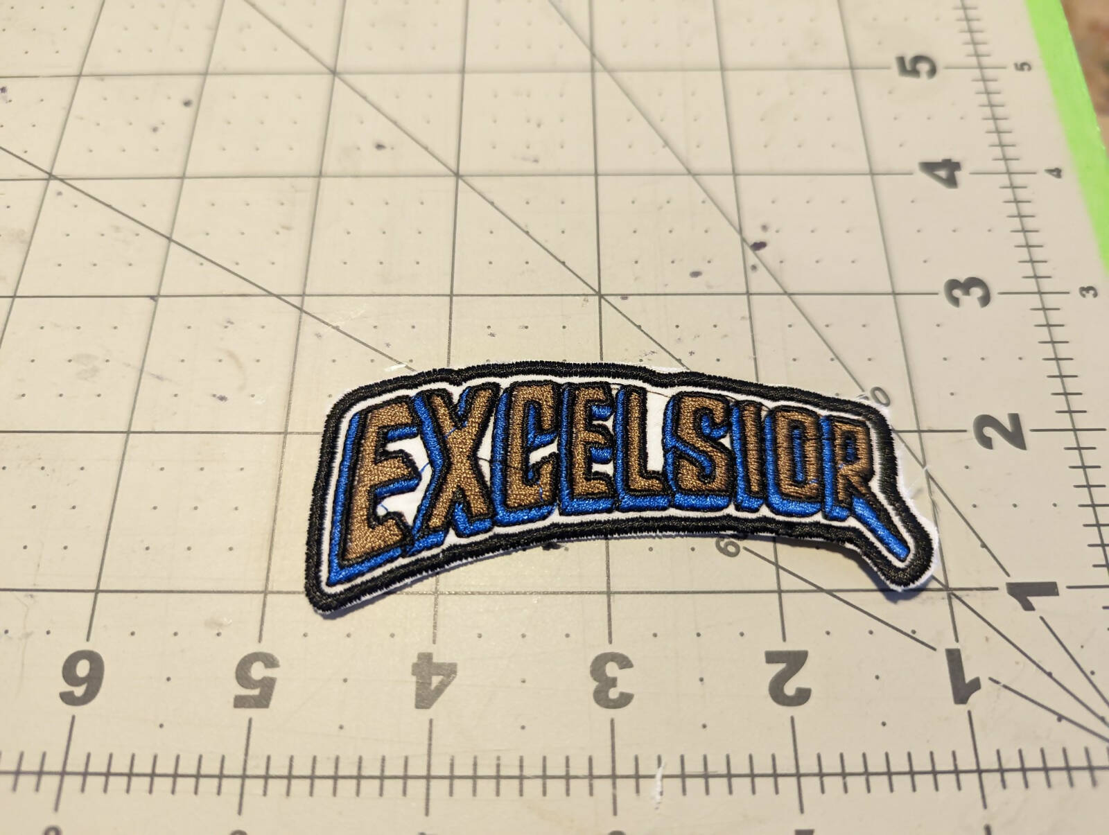 Excelsior Swoop Iron On Patch