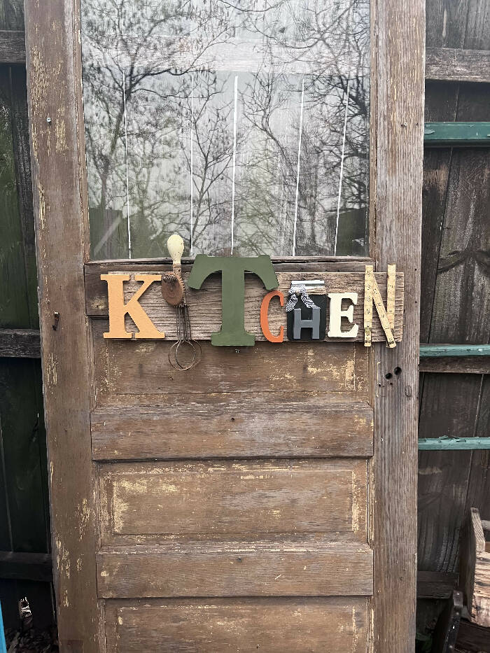 Kitchen sign with vintage egg beater