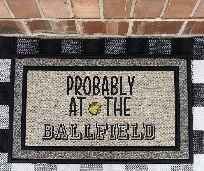 Probably at the ballfield - softball - Indoor/Outdoor Doormat