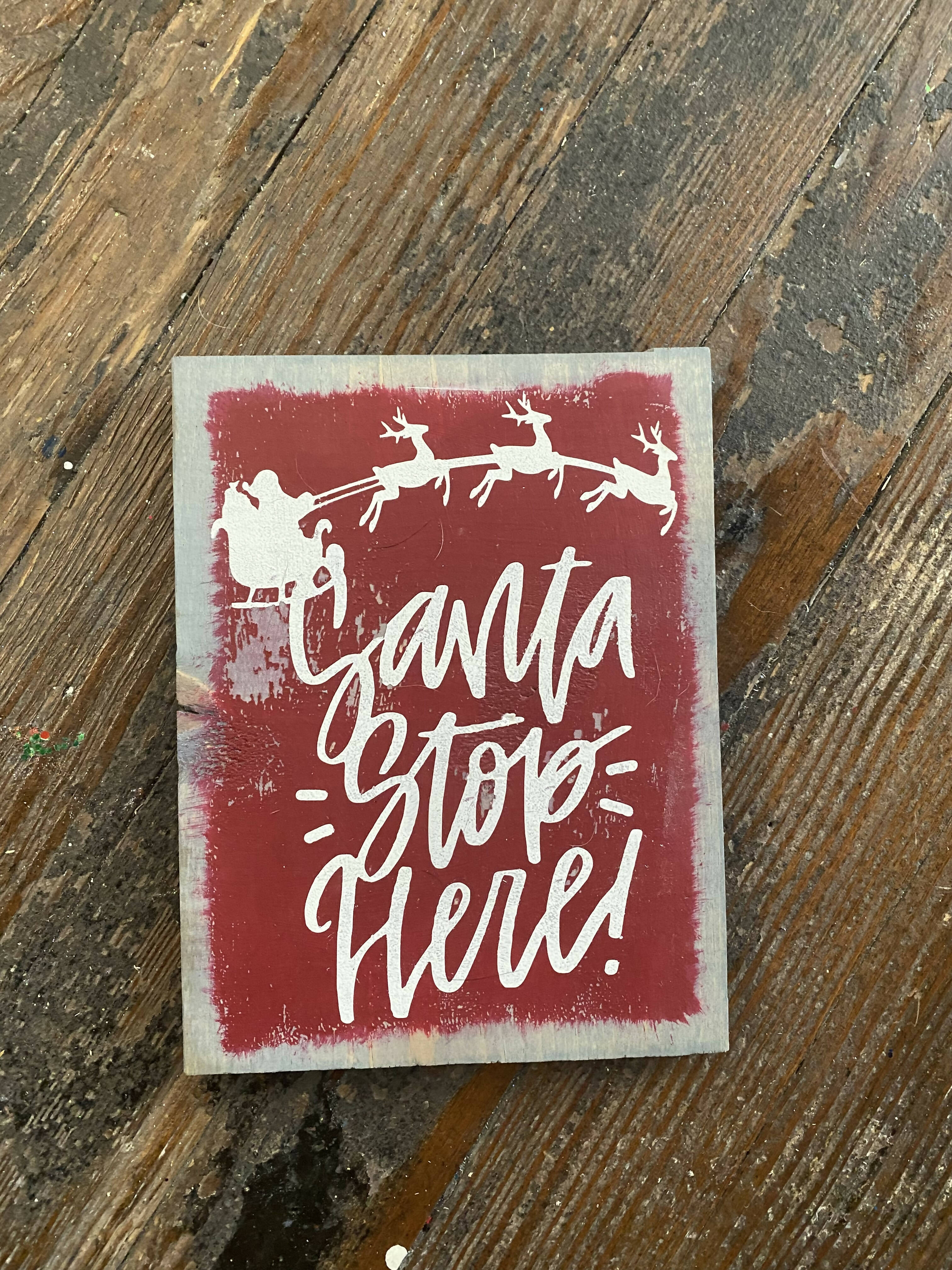 Red Santa Stop Here sign